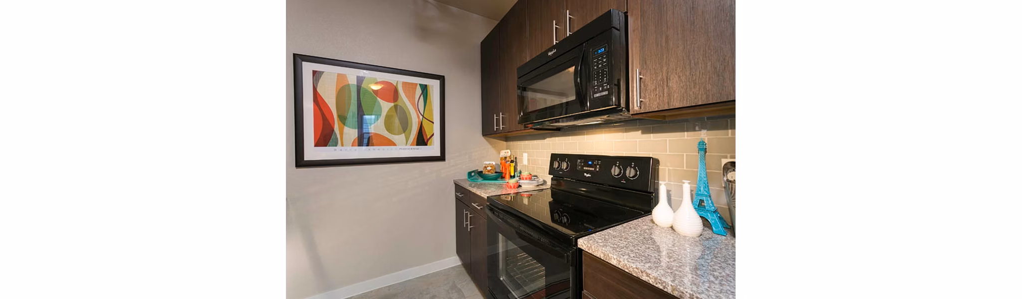 HiLine at Littleton Commons: Modern kitchen with stainless steel appliances and granite countertops in luxury apartments