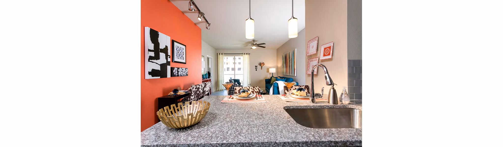 Modern kitchen with stainless steel appliances at HiLine at Littleton Commons Apartments