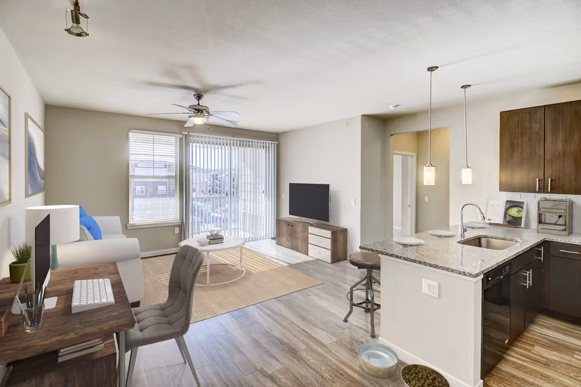 Spacious living room with modern decor at HiLine at Littleton Commons Apartments