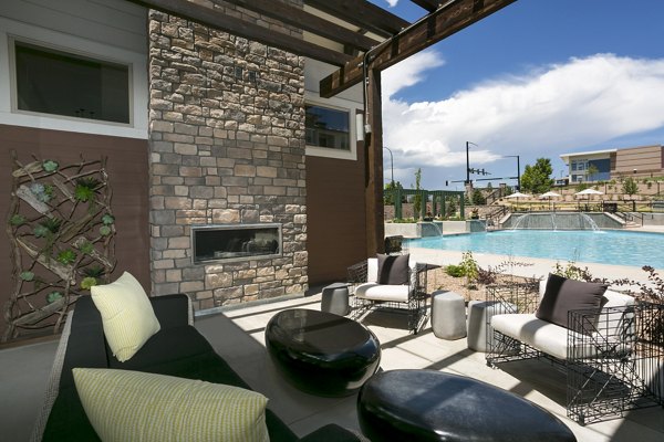 HiLine at Littleton Commons: Modern recreational area with lounge seating and billiards tables for apartments near Denver