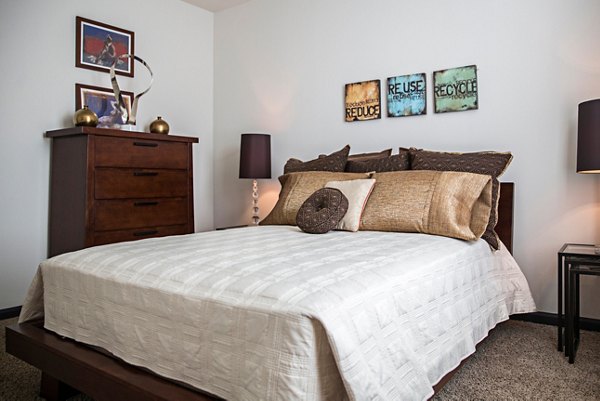 Bedroom with modern decor and natural lighting at Avana Westside Apartments