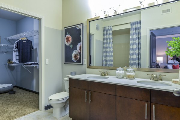 Bathroom featuring sleek fixtures and modern design at Avana Westside Apartments