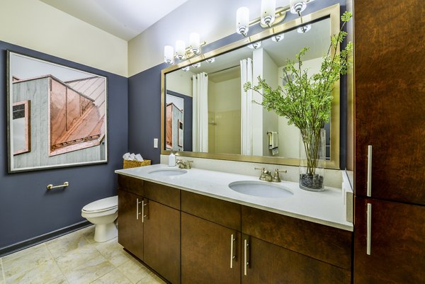 Bathroom featuring sleek fixtures and modern design at Avana Westside Apartments