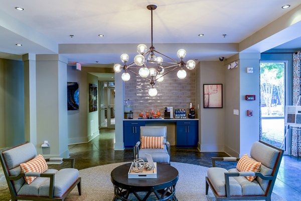 Clubhouse featuring modern decor and spacious seating at Avana Westside Apartments