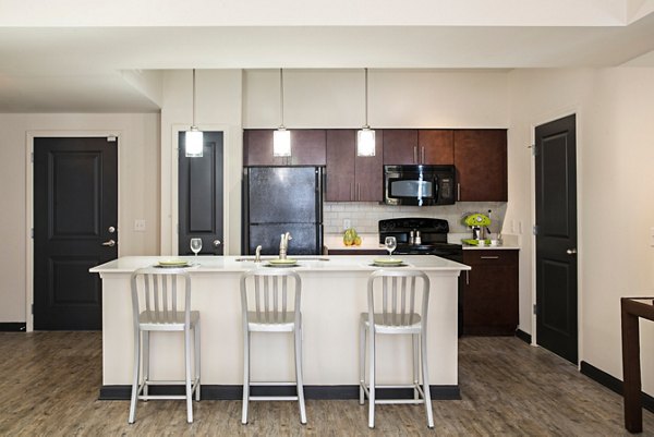 Modern kitchen featuring sleek countertops and stainless steel appliances at Avana Westside Apartments