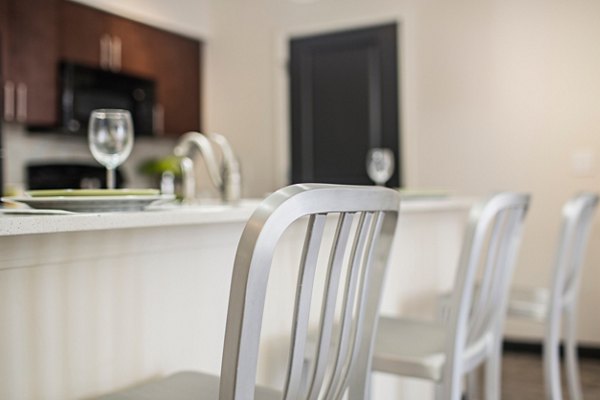 Modern kitchen with stainless steel appliances at Avana Westside Apartments, featuring sleek countertops and ample cabinetry for luxury living