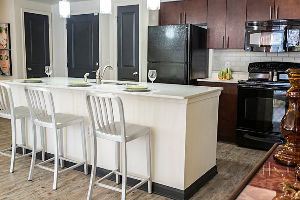 Modern kitchen with stainless steel appliances at Avana Westside Apartments