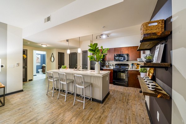 Contemporary kitchen with stainless steel appliances at Avana Westside Apartments