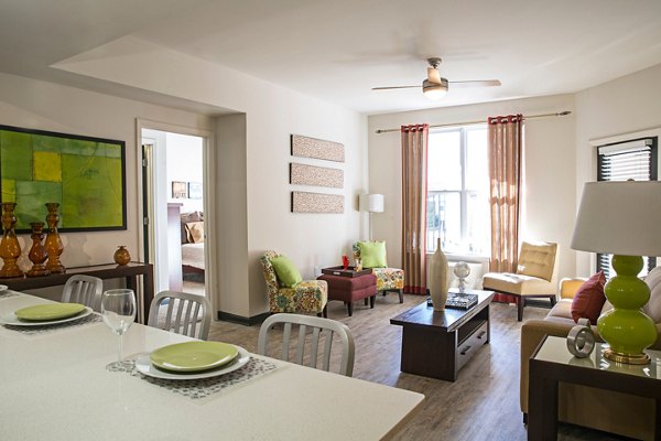 Cozy living room with contemporary design and plush seating at Avana Westside Apartments