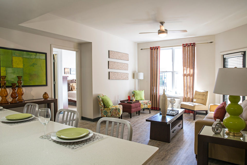 Cozy living room with contemporary design and plush seating at Avana Westside Apartments