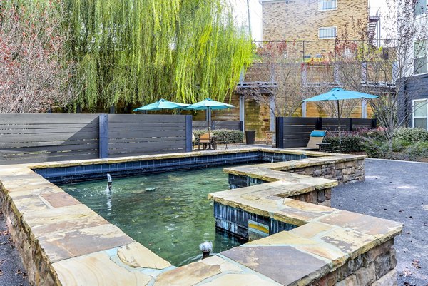 Courtyard with lush landscaping and seating at Avana Westside Apartments, a luxury community by Greystar