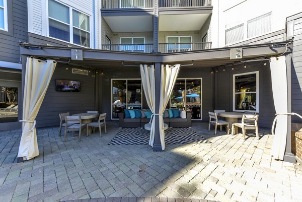 Spacious patio with modern seating at Avana Westside Apartments, ideal for relaxing and entertaining outdoors