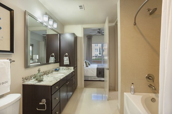 Luxurious bathroom with modern fixtures at One Lakes Edge apartments, featuring sleek design and premium finishes in The Woodlands