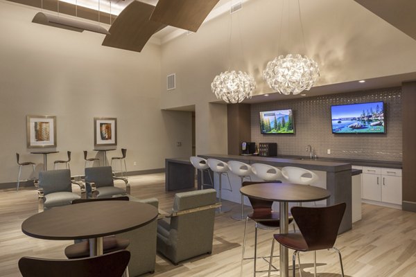 Clubhouse with upscale furnishings and modern lighting at One Lakes Edge luxury apartments in a vibrant community