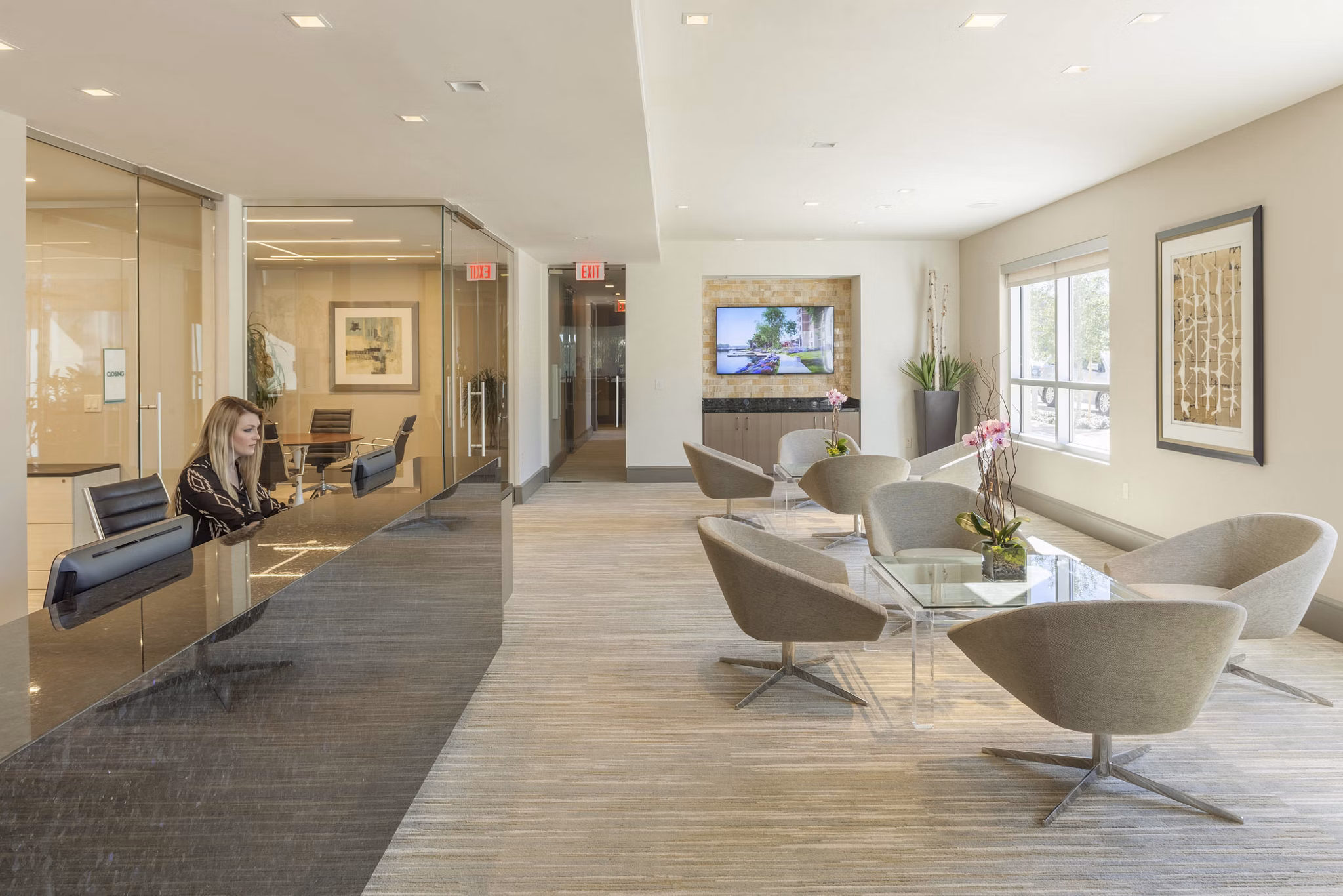 Clubhouse featuring modern furnishings and a cozy lounge area at One Lakes Edge luxury apartments