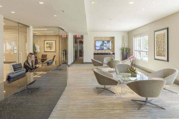 Clubhouse featuring modern furnishings and a cozy lounge area at One Lakes Edge luxury apartments