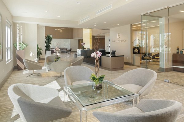 Modern clubhouse featuring lounge areas and game room at One Lakes Edge luxury apartments