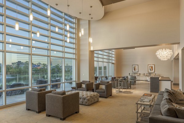 Clubhouse lounge with modern decor and cozy seating at One Lakes Edge luxury apartments