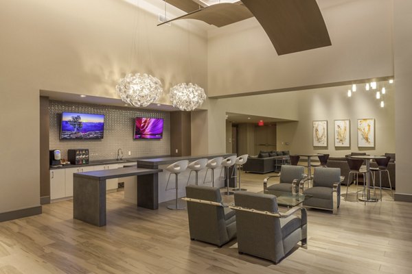 Modern clubhouse with lounge seating and pool tables at One Lakes Edge luxury apartments