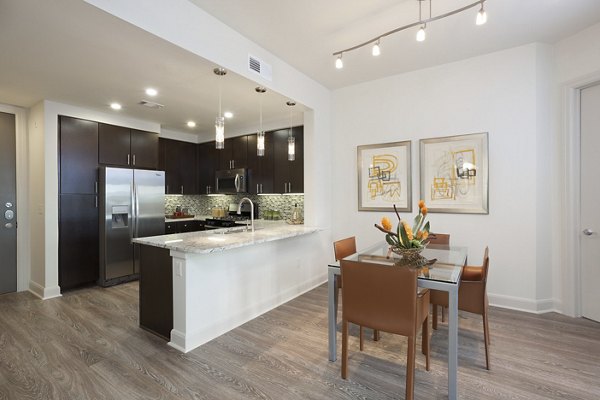 Dining area featuring modern decor and pendant lighting at One Lakes Edge luxury apartments
