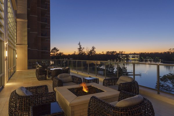 Cozy fire pit area at One Lakes Edge overlooking scenic views, ideal for relaxation and social gatherings