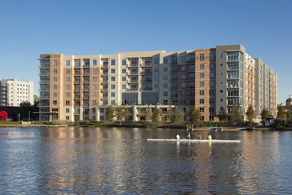 Exterior view of One Lakes Edge: Contemporary luxury apartments surrounded by scenic waterfront, located conveniently near city amenities