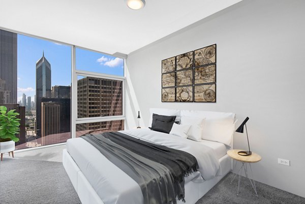 Cozy bedroom with modern decor at Aston Apartments