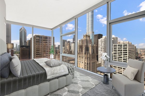 Spacious bedroom with modern furnishings at Aston Apartments