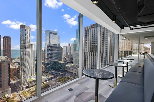 Elegant clubhouse with modern seating and fireplace at Aston Apartments, a Greystar luxury community