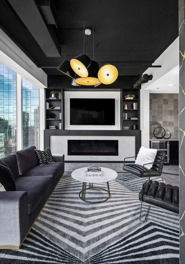 Clubhouse featuring modern design and community seating at Aston Apartments