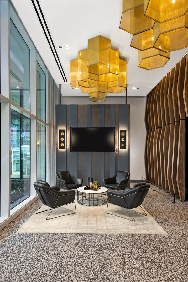 Modern clubhouse featuring cozy seating and open layout at Aston Apartments