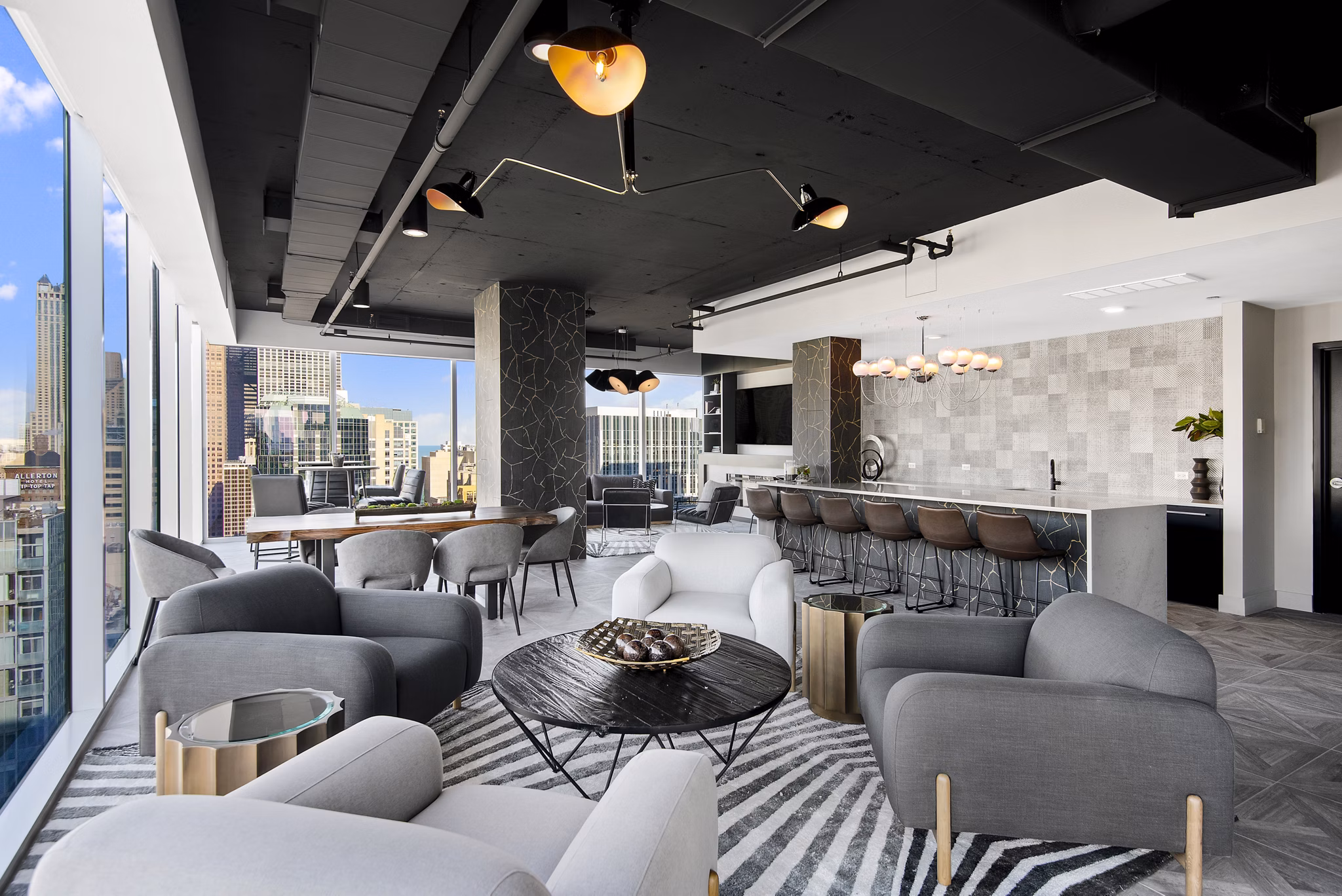 Clubhouse at Aston Apartments featuring modern design and comfortable seating areas for residents