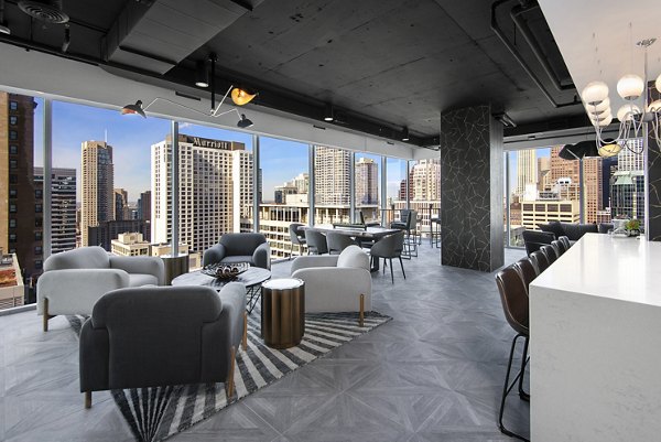 Clubhouse featuring modern seating and open design at Aston Apartments luxury living community