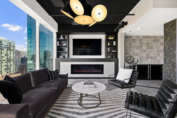 Modern clubhouse with comfortable seating and sleek decor at Aston Apartments, offering a luxurious living experience