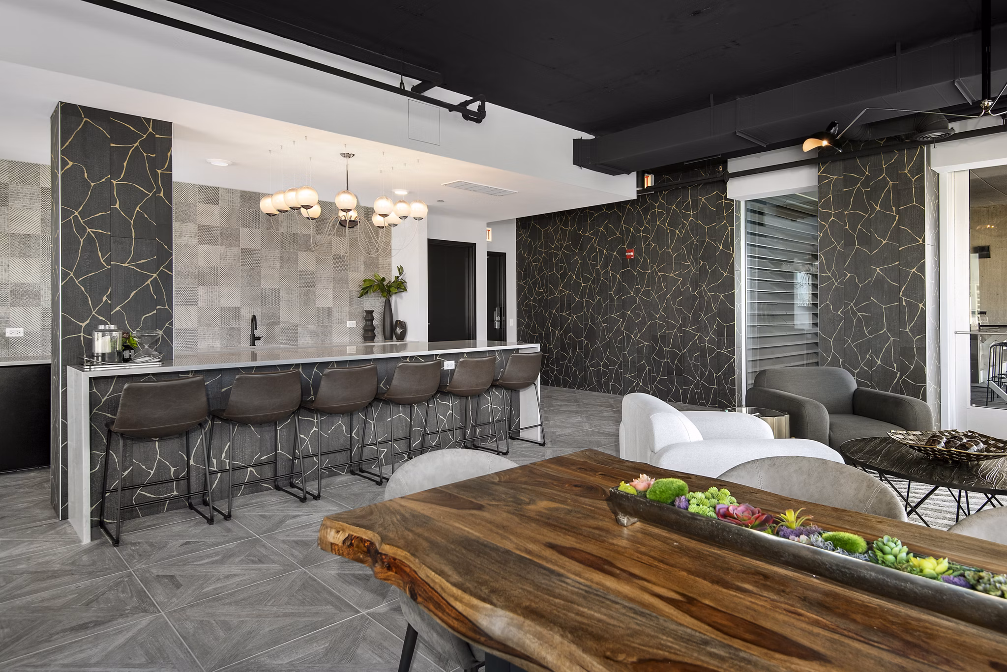 Clubhouse featuring modern design and lounge seating at Aston Apartments
