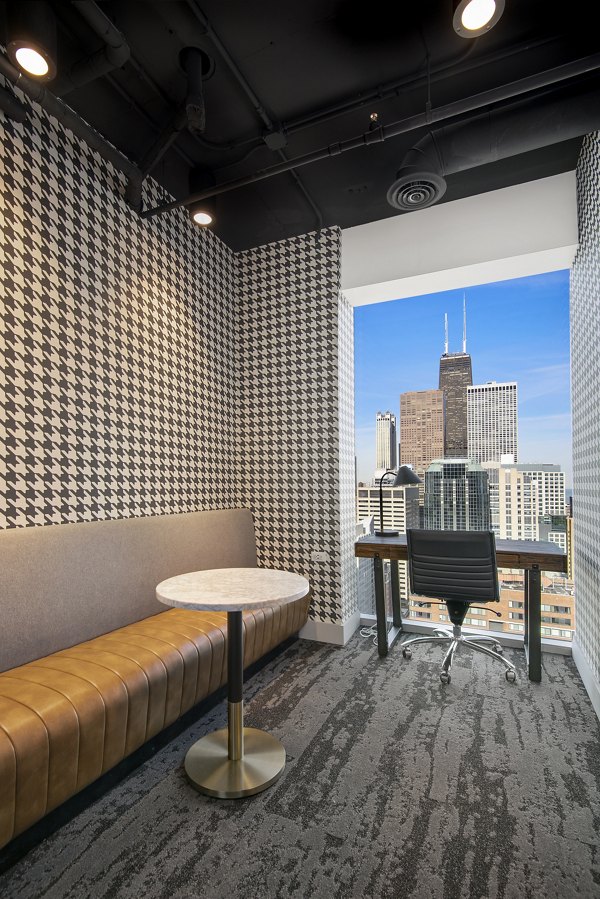 Clubhouse featuring modern furnishings and recreational areas at Aston Apartments