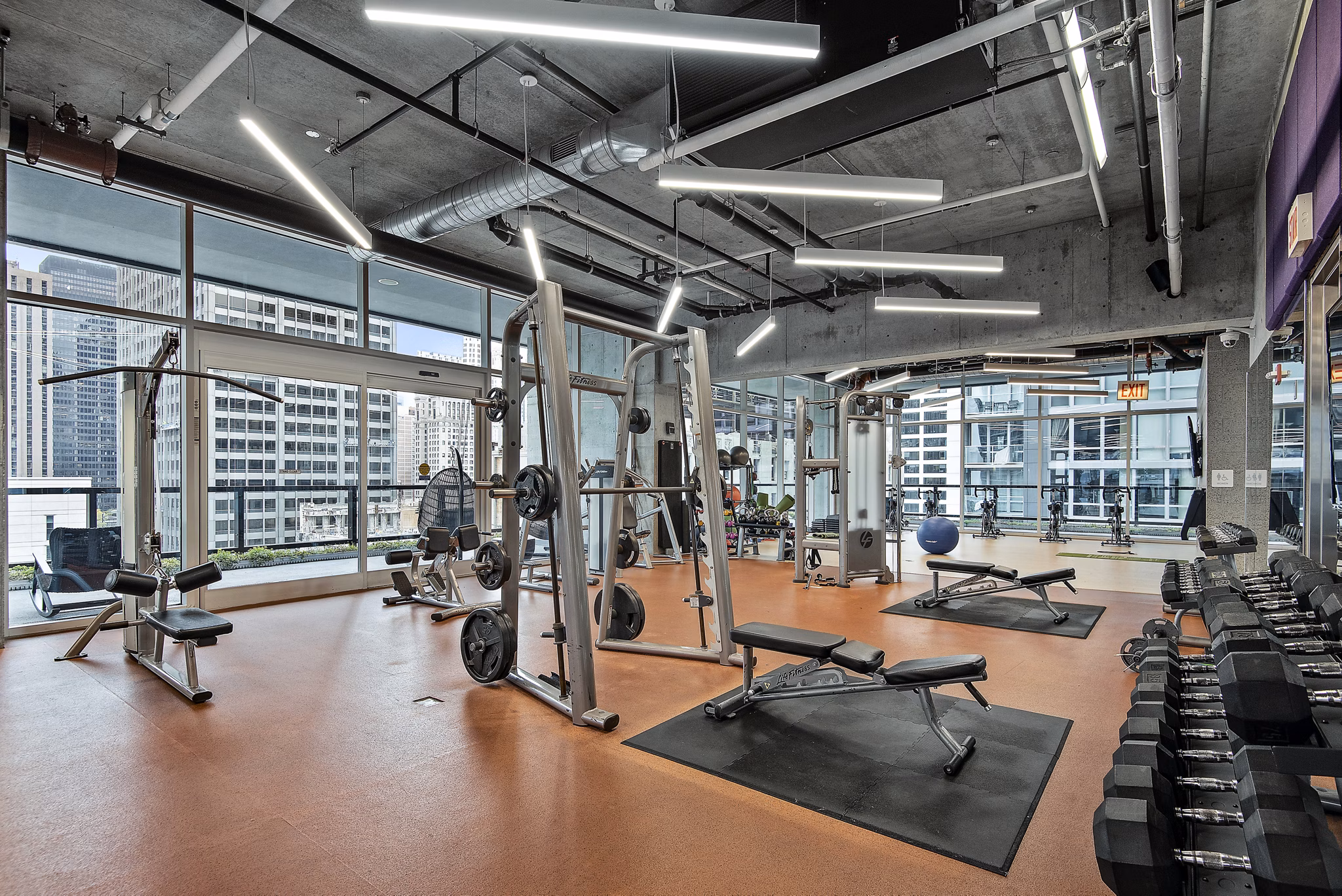 State-of-the-art fitness center with modern equipment at Aston Apartments, ensuring an exceptional workout experience for residents