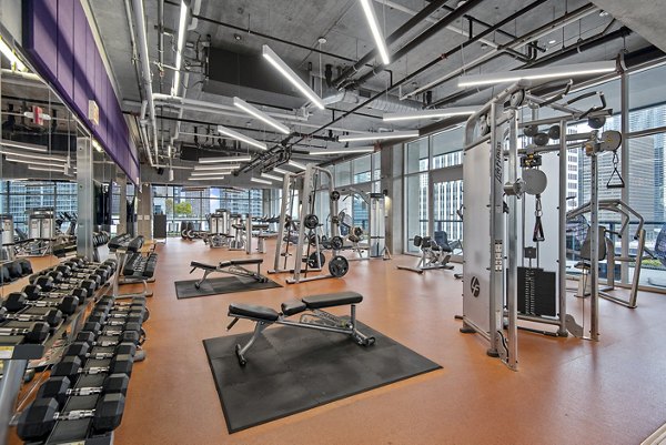 Modern fitness center with state-of-the-art equipment at Aston Apartments