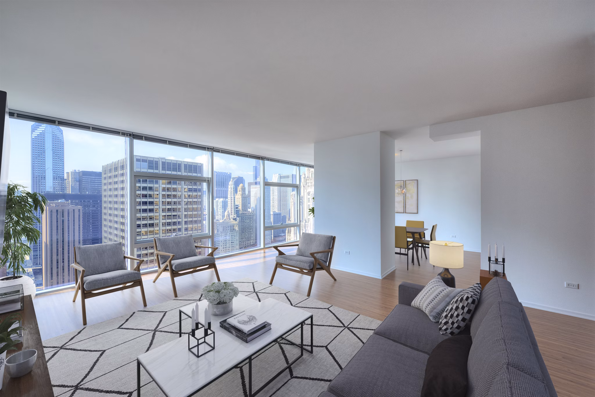 Modern living room with stylish decor in Aston Apartments, featuring comfortable seating and large windows for natural light