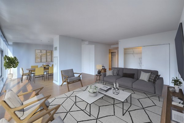 Spacious living room with modern decor and natural light in Aston Apartments, a Greystar luxury property