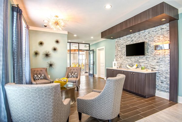 Clubhouse featuring modern design and comfortable seating at Jones Grant Luxury Apartments