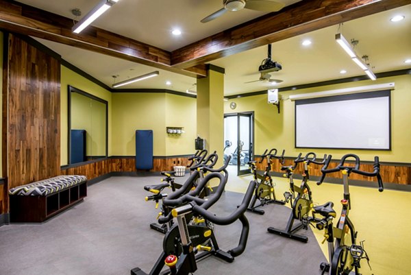 State-of-the-art fitness center featuring modern equipment at Jones Grant Luxury Apartments