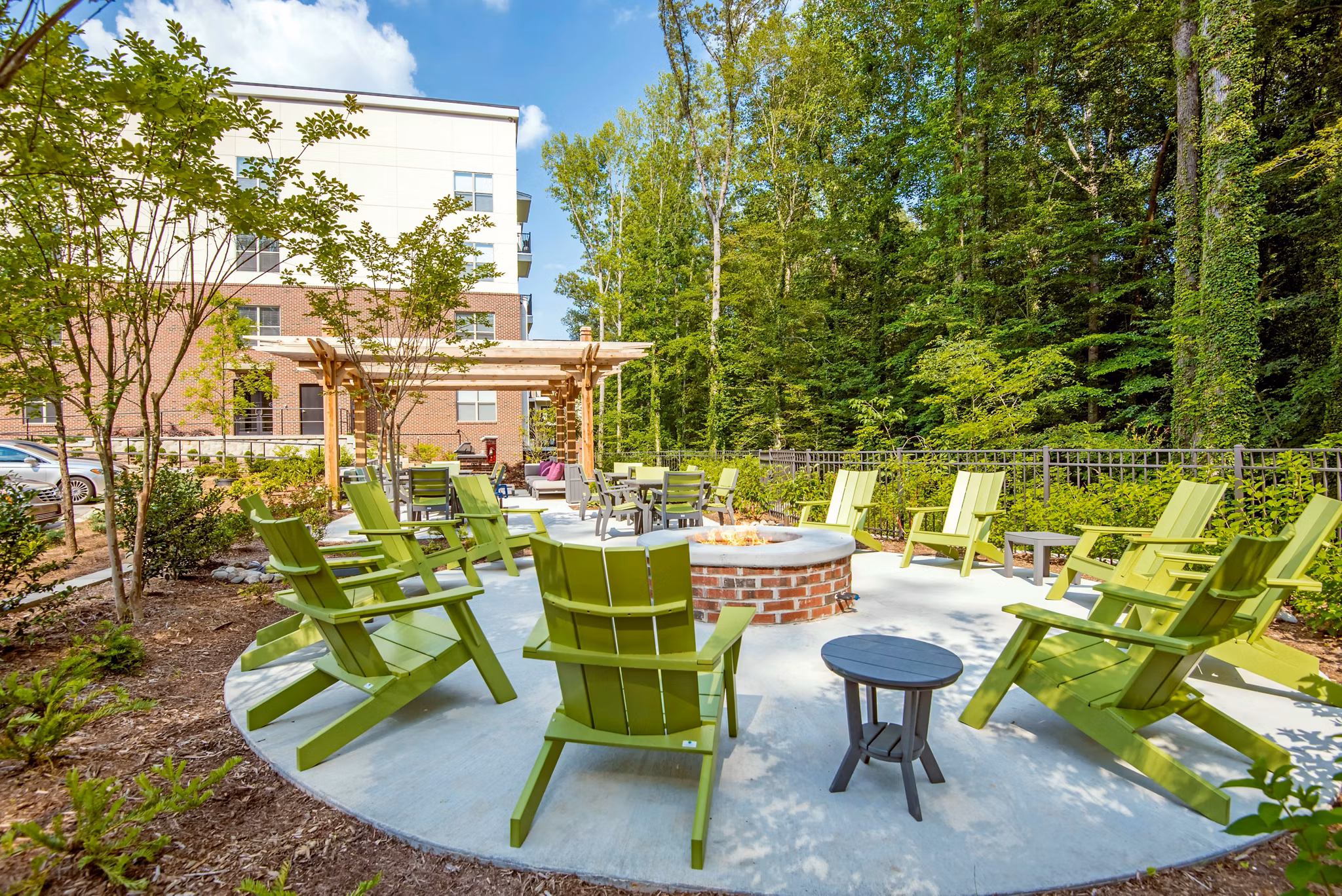 Cozy outdoor fire pit at Jones Grant Luxury Apartments, perfect for relaxing and socializing in a luxurious setting