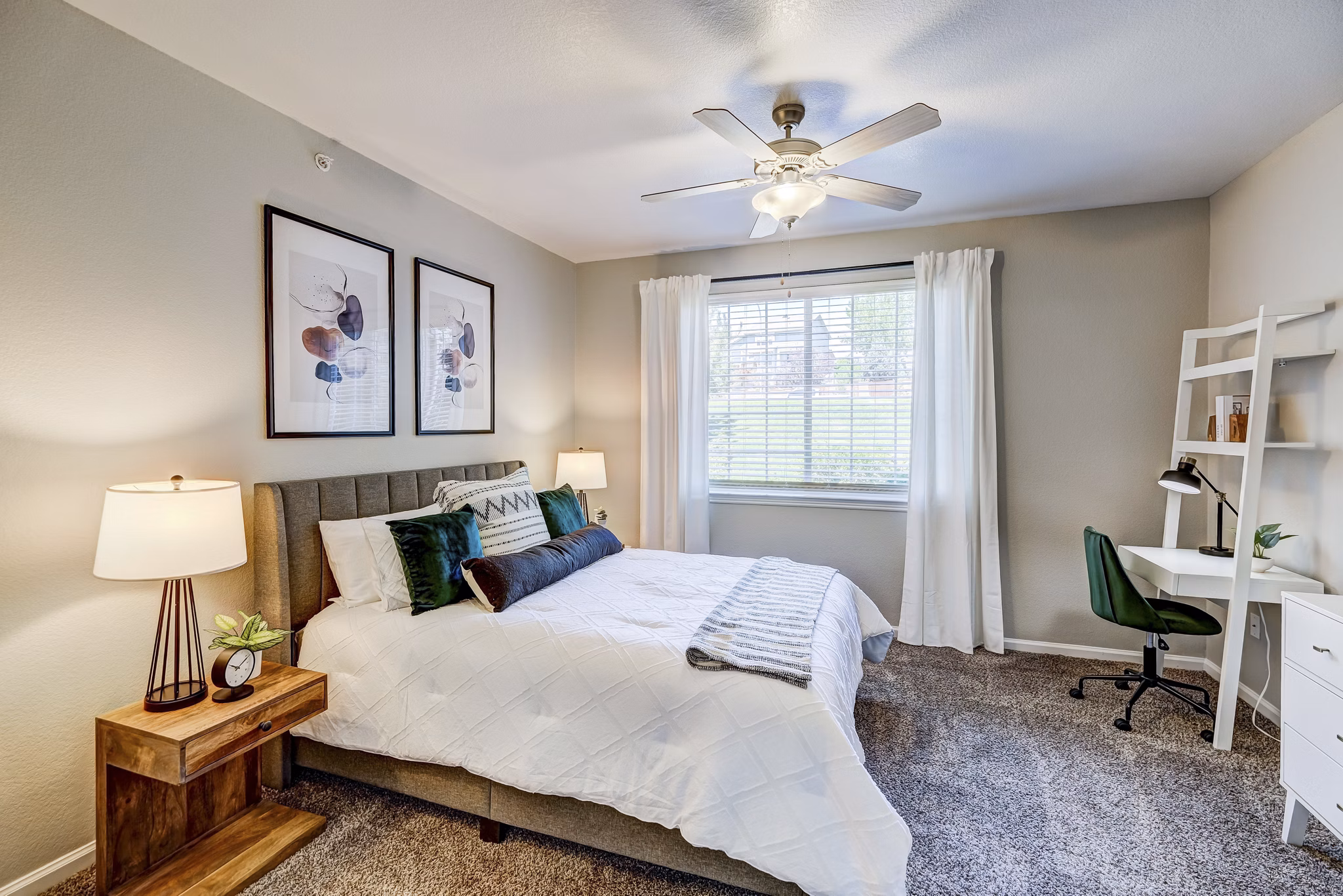 Cozy bedroom with queen-size bed and modern decor at Champions Apartments