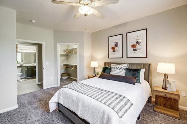 Elegant bedroom featuring contemporary design at Champions Apartments in luxury Greystar community