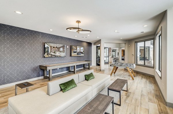 Clubhouse with modern design and ample seating in Champions Apartments
