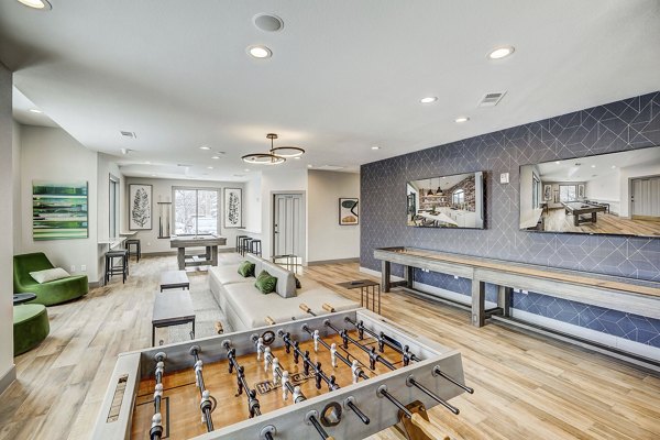 Clubhouse featuring modern design elements at Champions Apartments in a luxury Greystar community