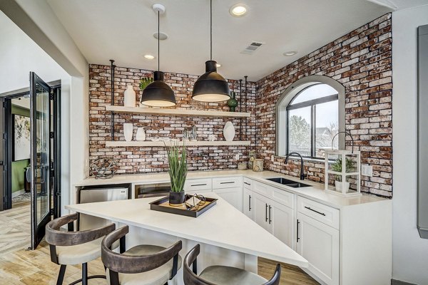 Modern clubhouse with stylish seating and decor at Champions Apartments