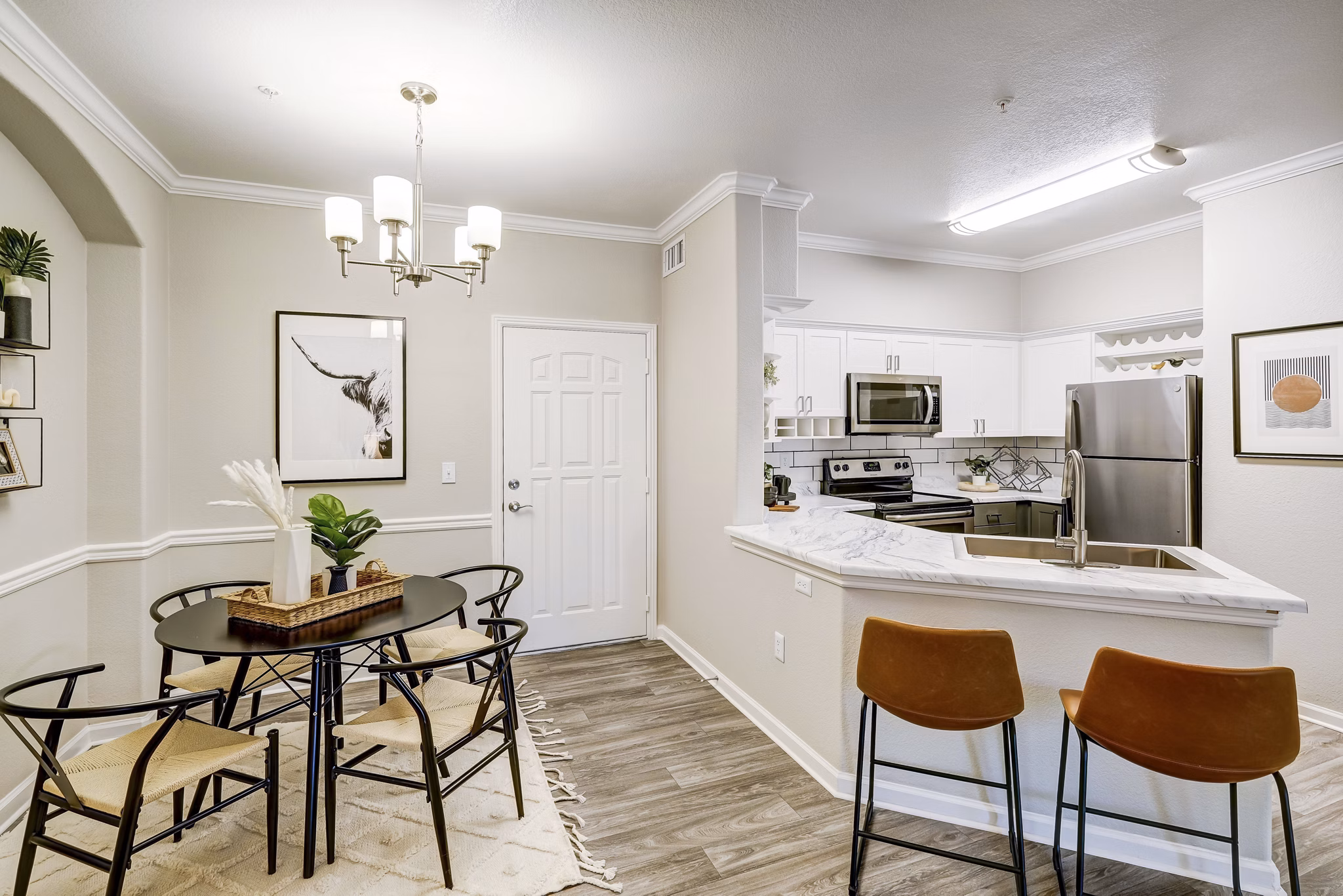 Elegant dining room with modern furnishings at Champions Apartments