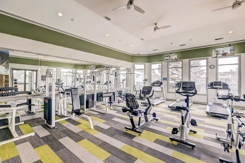 Cutting-edge fitness center with modern equipment at Champions Apartments